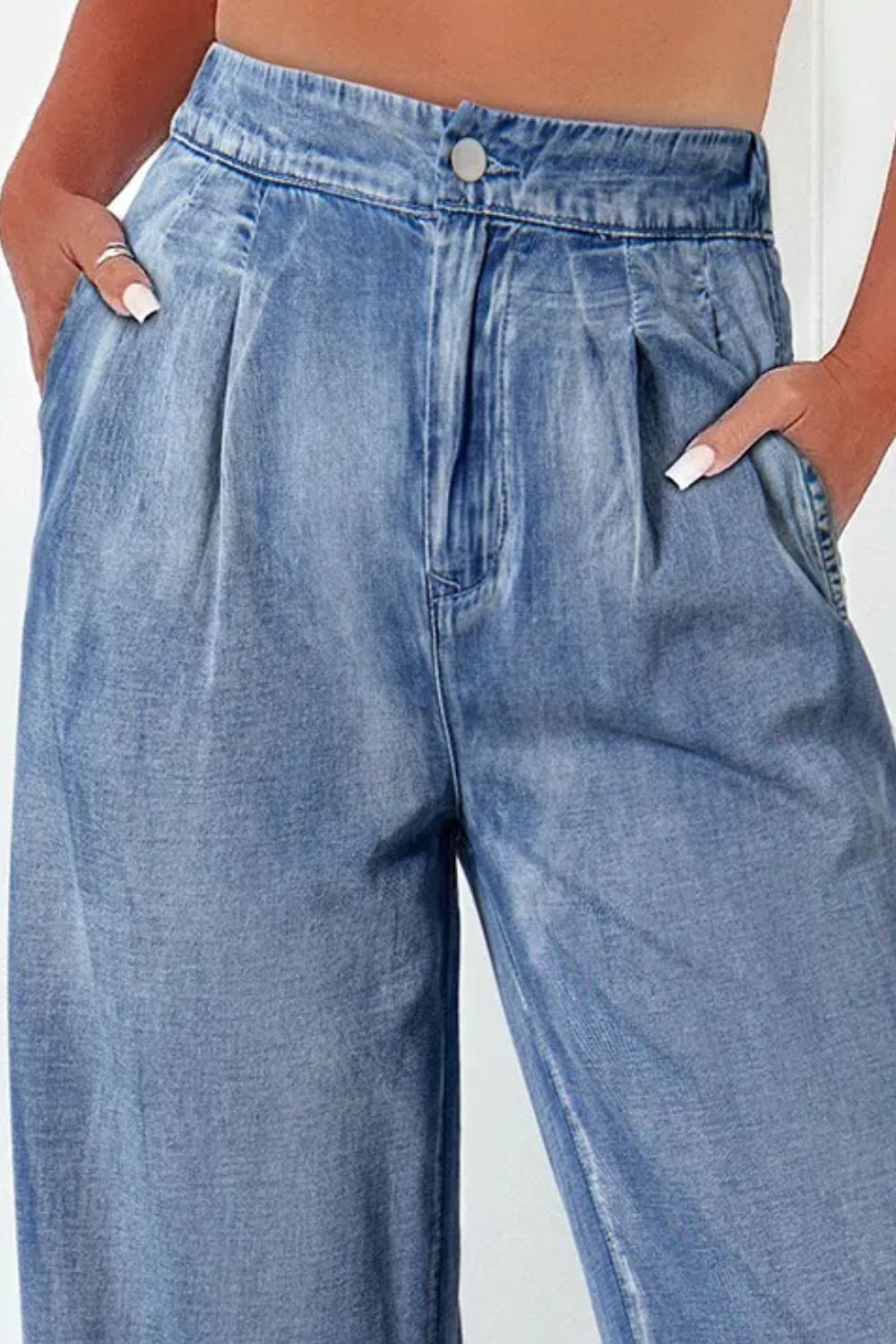 a woman is wearing a pair of blue jeans