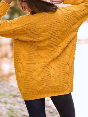 Gold cable-knit open front cardigan, long sleeves.