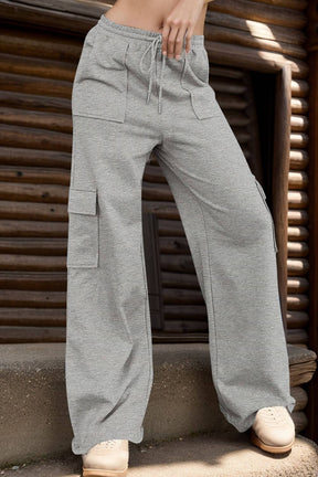 Gray drawstring active pants with pockets, full length view