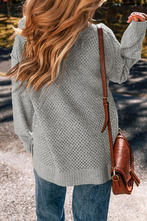 Back view of gray openwork V-neck sweater