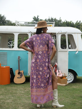 Blue floral-patterned maxi dress by BrandName, size M, elegant flowy style.