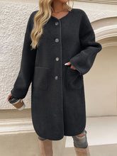 Black button-up long sleeve coat front view