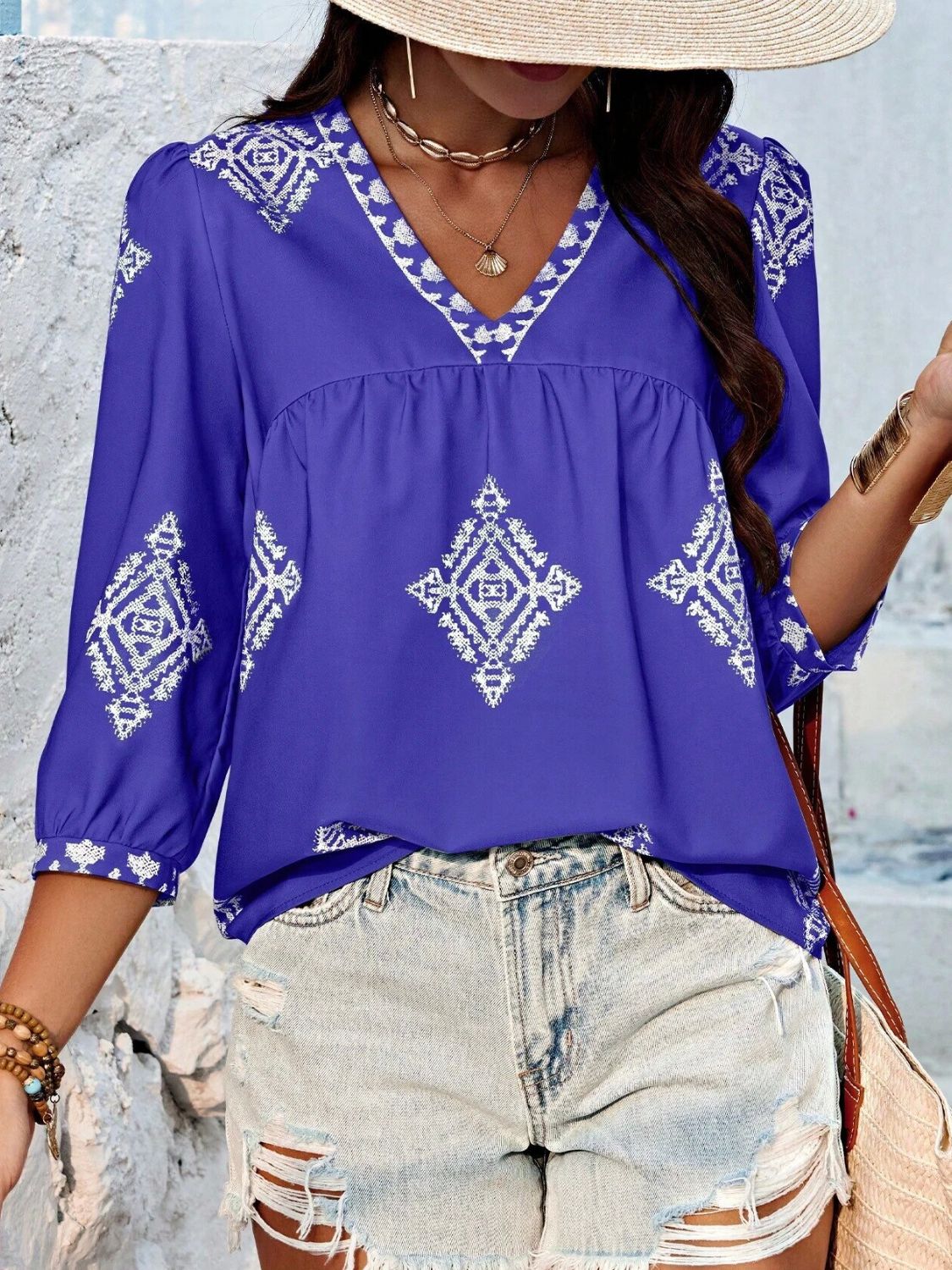 Purple printed V-neck three-quarter sleeve blouse