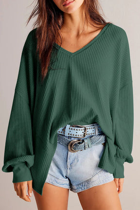 Green waffle-knit V-neck long sleeve top with denim shorts