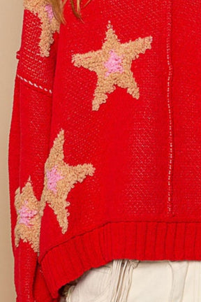 Close-up of star patches on red sweater.