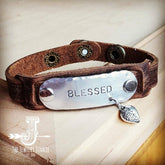 a brown leather bracelet with a metal clasp