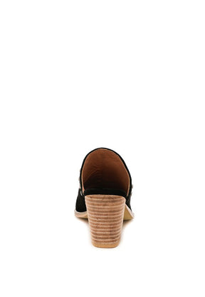 Rear view of black Leslie stacked heel mules