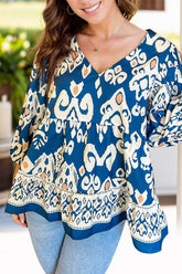 Chic printed V-neck blouse with three-quarter sleeves