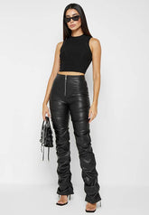 Model wearing sexy PU leather pants, high waist, skinny fit