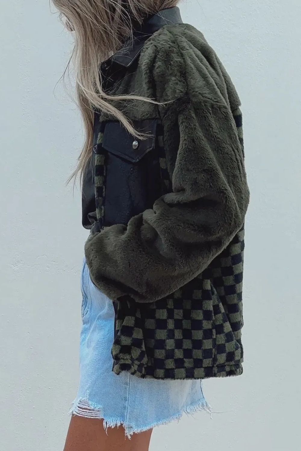 Side view of checkered collared neck jacket in green.