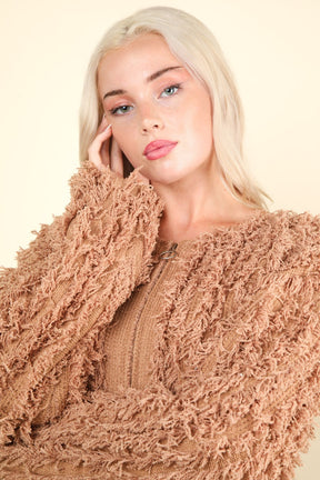 Close-up of shaggy yarn knit zip-up jacket in mocha.