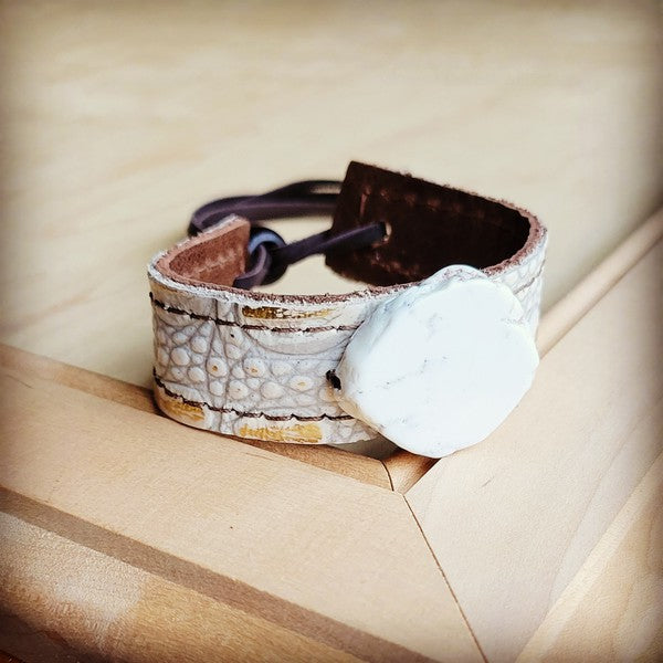 Narrow leather cuff with turquoise slab and gold gator design