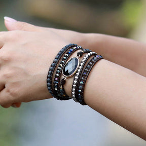 Agate beaded bracelet worn on wrist, showcasing layered style.