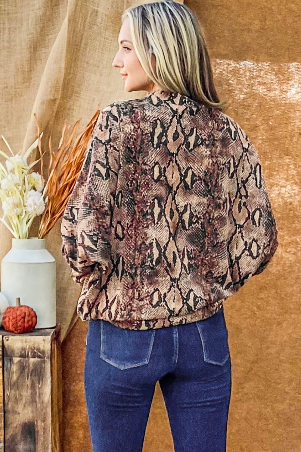 Choker neck dolman sleeve snake print top, back view