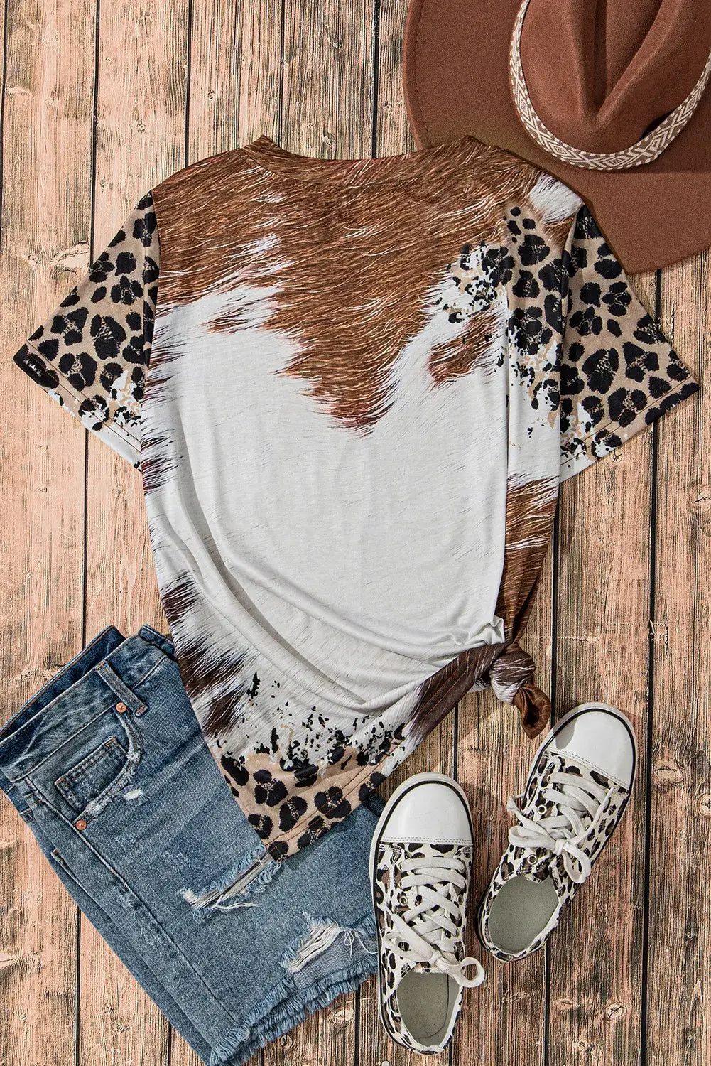 Back view of sunflower graphic T-shirt with animal print and casual outfit.