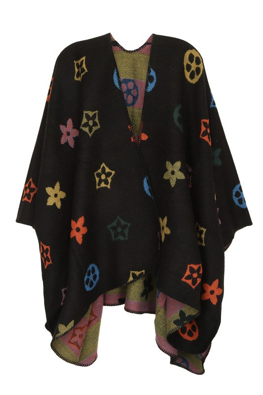 Black poncho with colorful geometric patterns