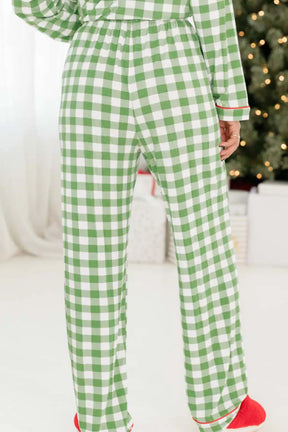 Back view of green plaid lounge pants with contrast piping