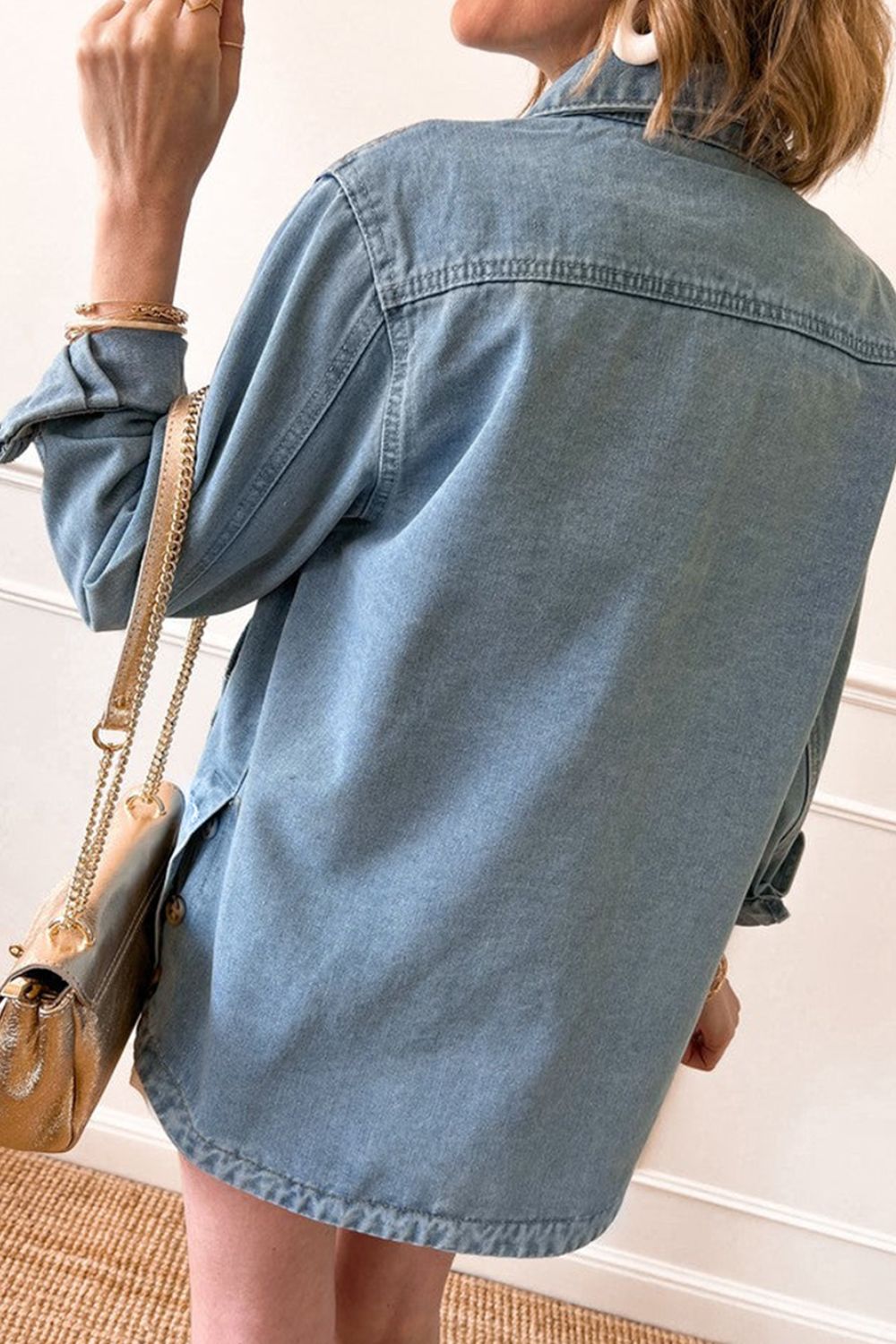 Pocketed button up long sleeve denim jacket, back view