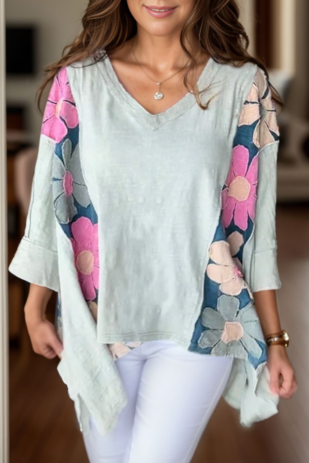 Light green floral V-neck blouse with three-quarter sleeves