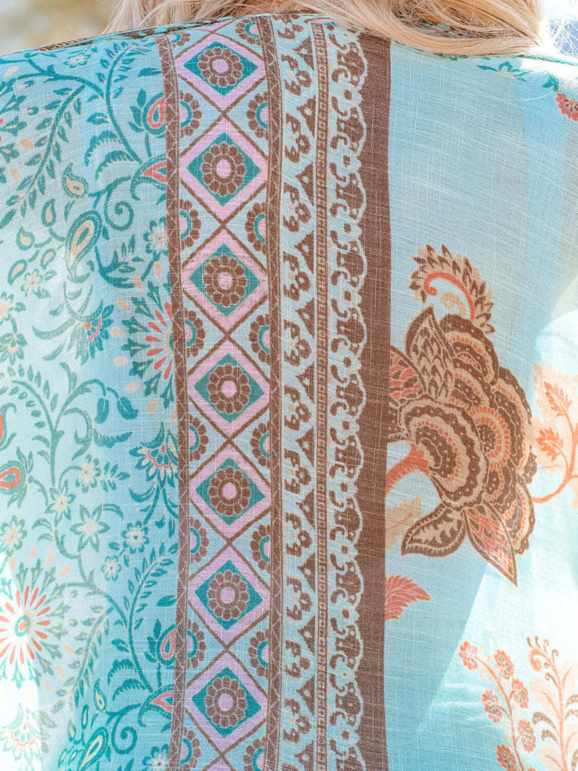 Close-up of blue printed fabric design on cover-up