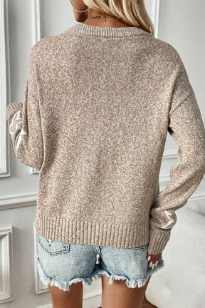 Back view of beige star dropped shoulder sweater