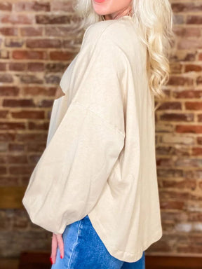 Side view of beige star long sleeve blouse