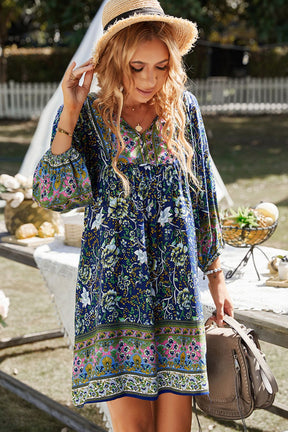 Bohemian tie neck balloon sleeve dress in blue floral pattern