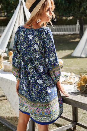 Back view of blue floral bohemian balloon sleeve dress