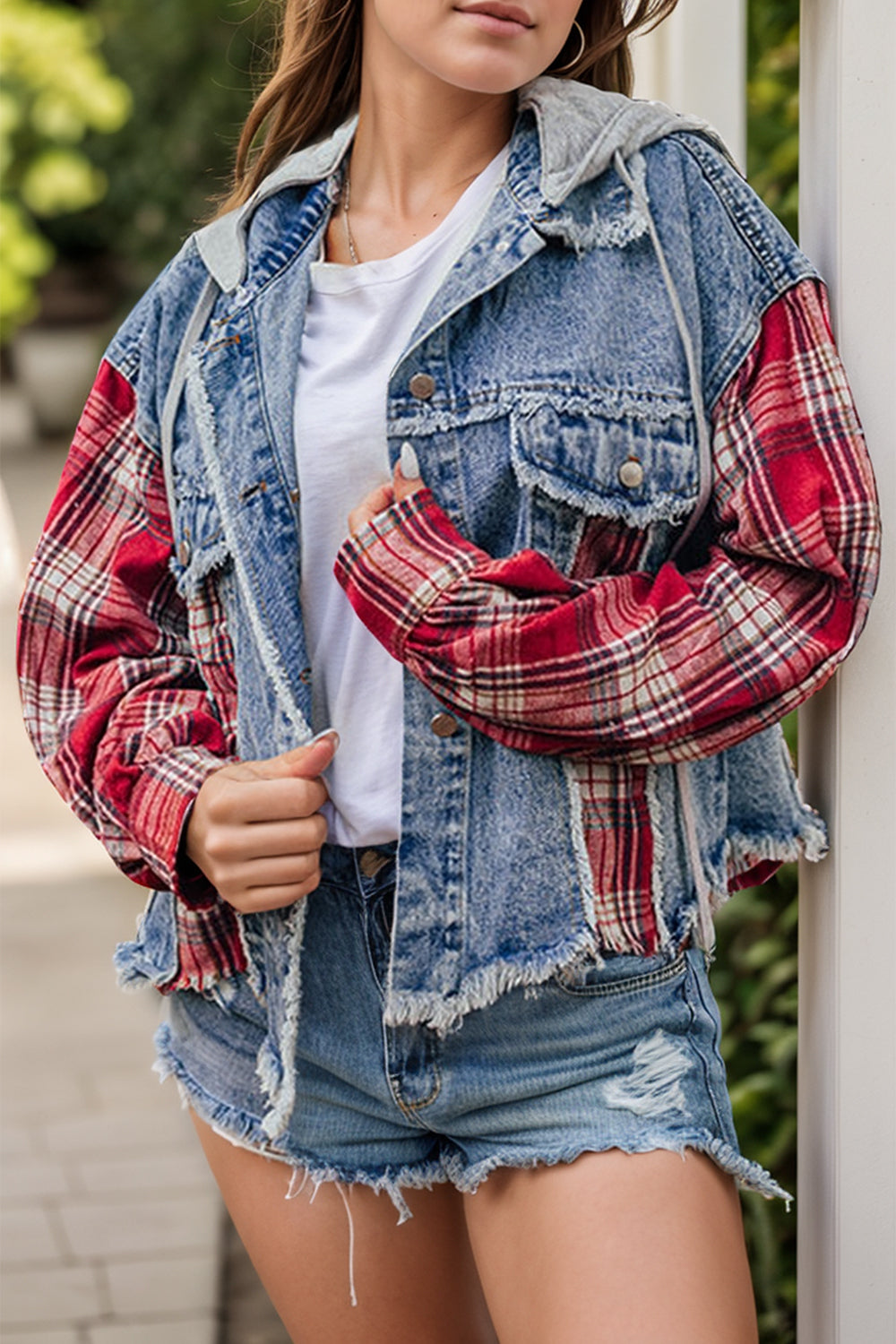 Raw hem drawstring plaid denim jacket worn outdoors