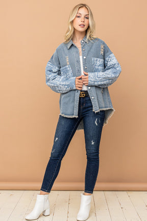 Model wearing paisley print quilted sleeves denim jacket