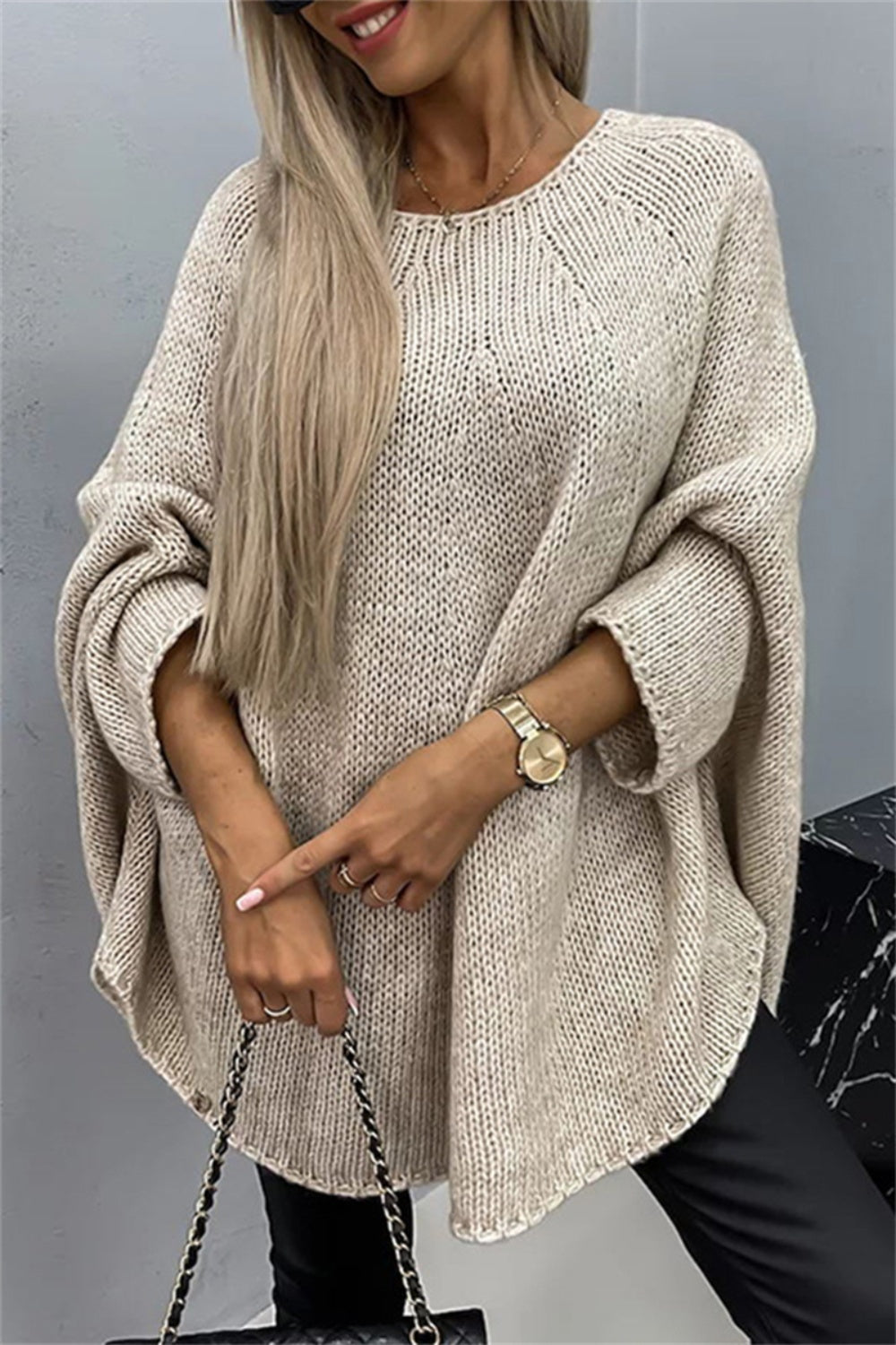 Beige round neck batwing sleeve sweater, cozy and stylish.