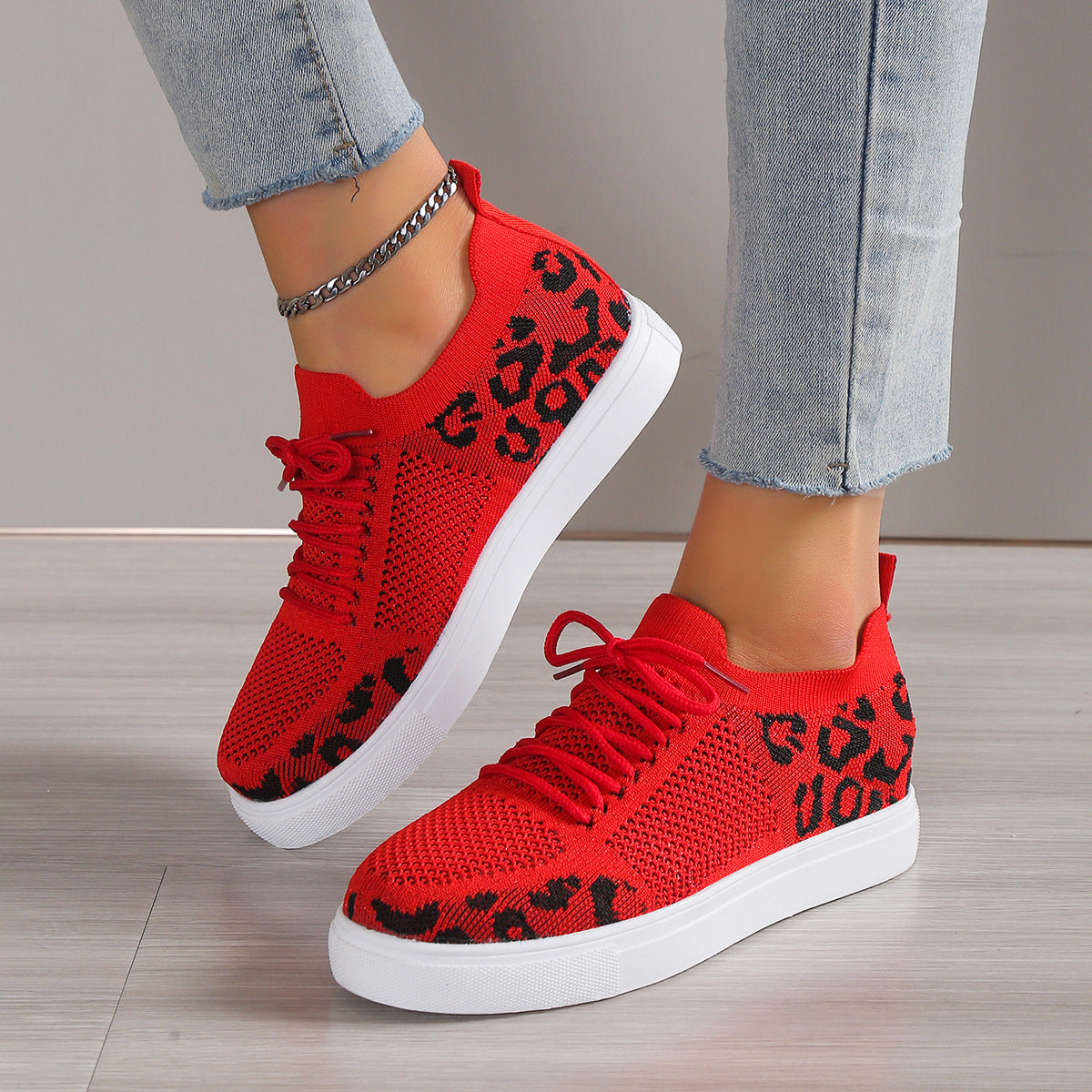 Red lace-up leopard flat sneakers with red laces