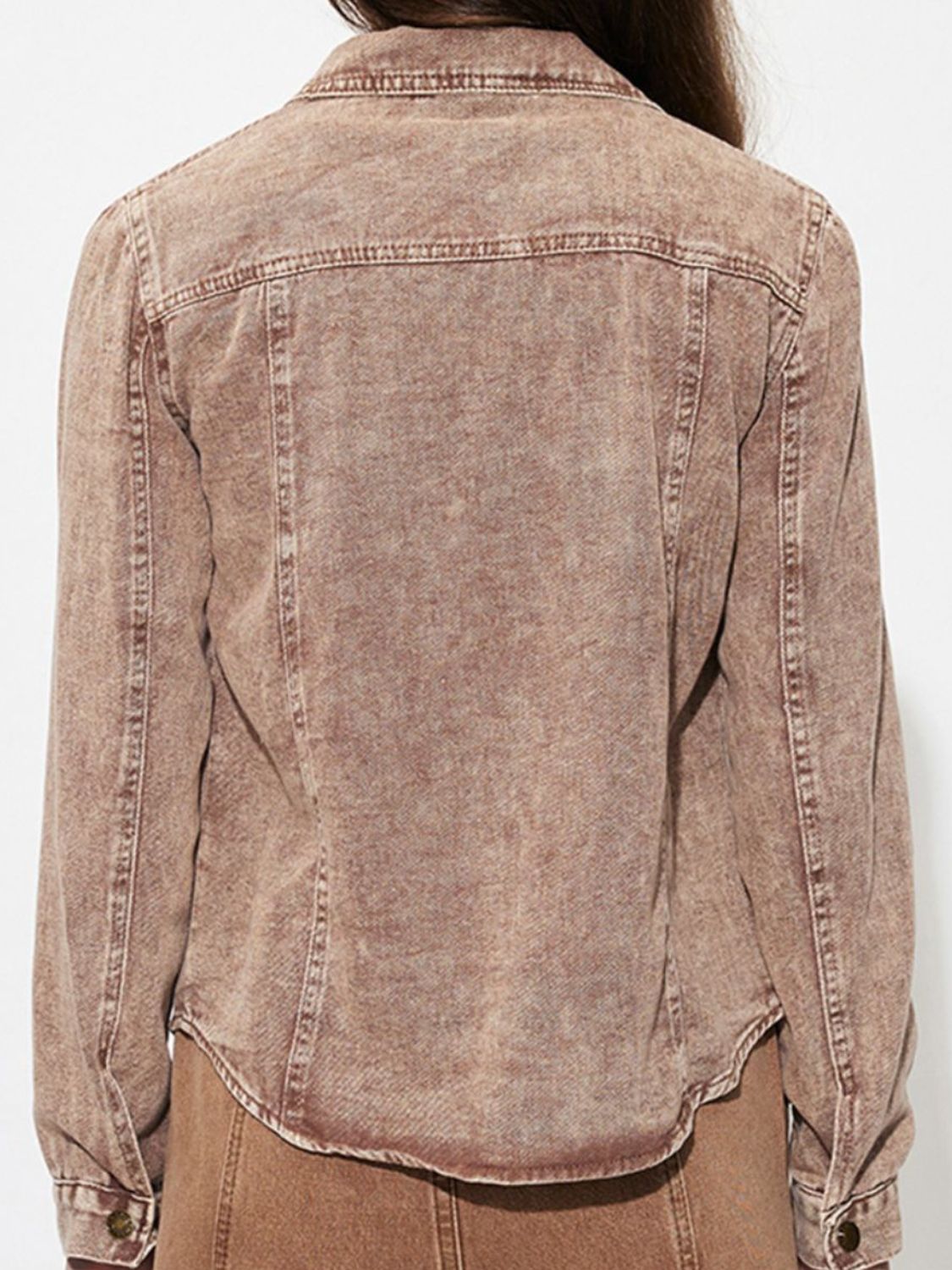 Back view of button up long sleeve denim jacket