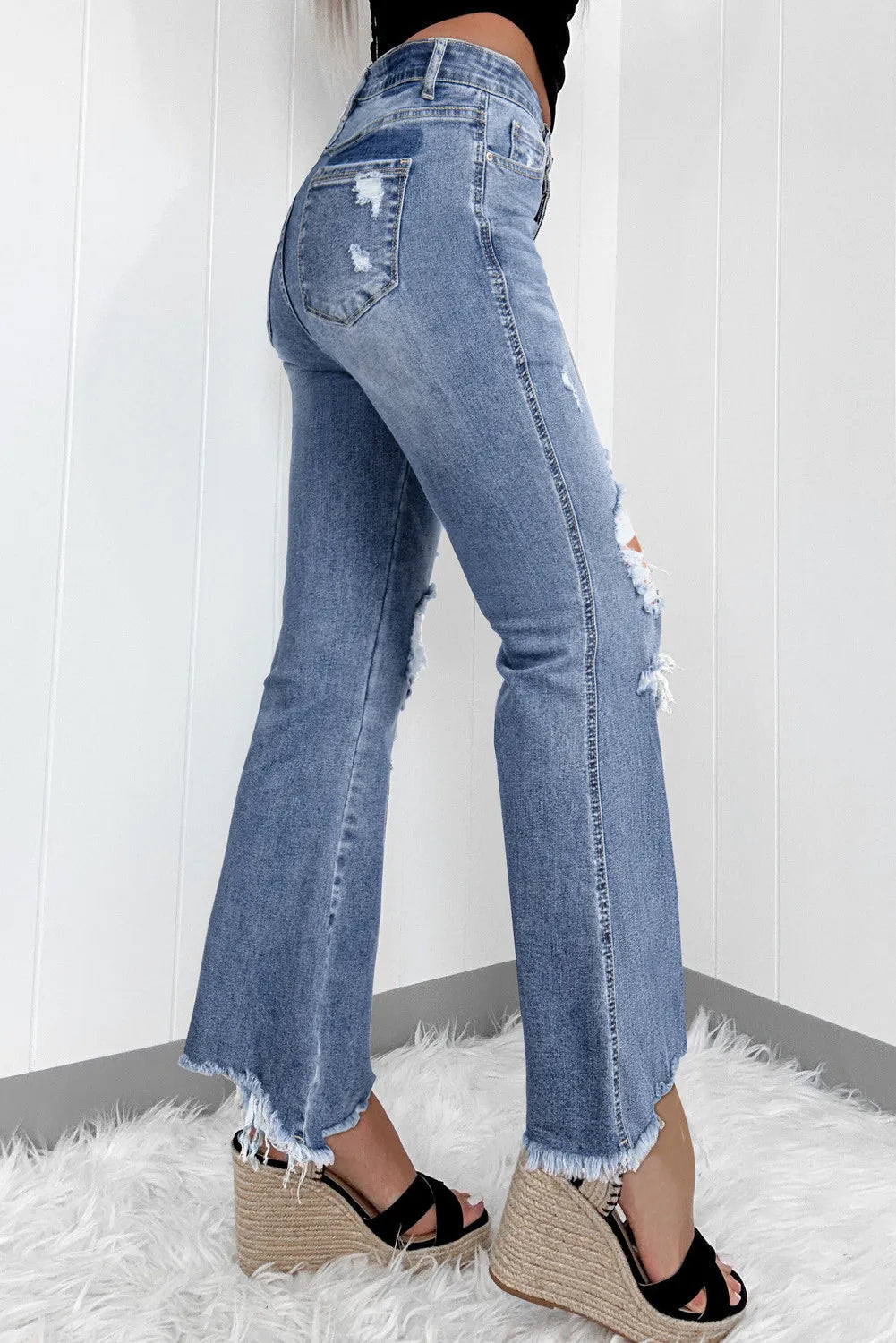 Distressed raw hem wide-cut jeans side view