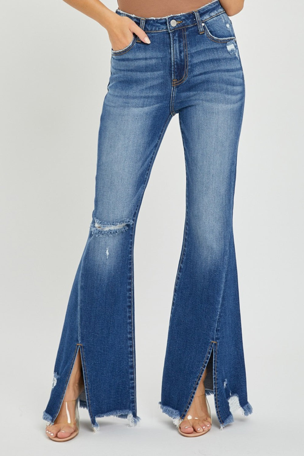 High rise flare jeans with front slit and frayed hem