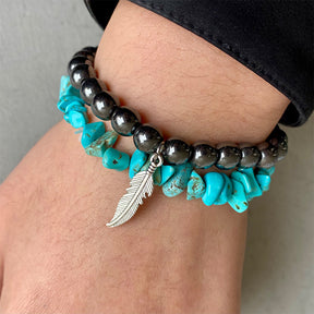 Turquoise alloy bracelet with feather charm