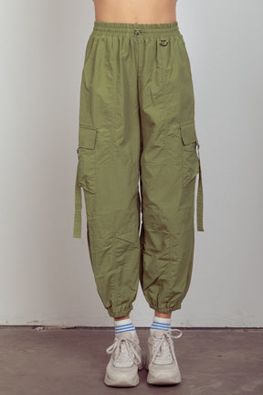 Front view of green elastic waist woven cargo pants