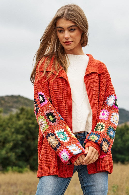 Red crochet floral knit cardigan with colorful sleeves