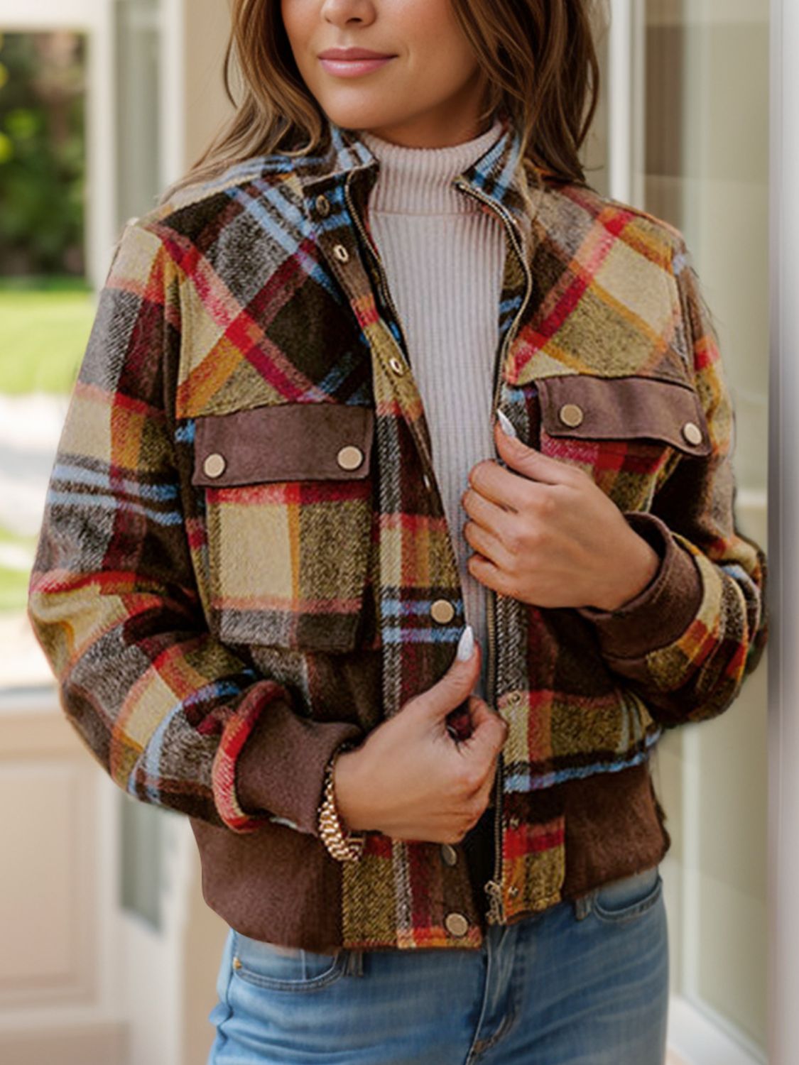 Front view of pocketed plaid long sleeve jacket