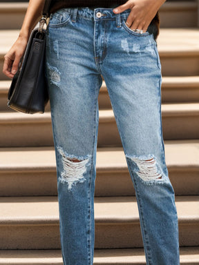 Trendy distressed jeans with raw hem and pockets