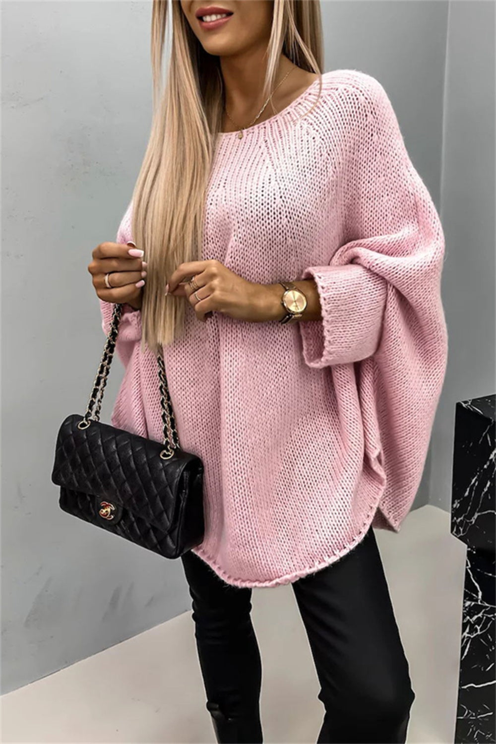 Pink batwing sleeve sweater with round neck, stylish and warm.