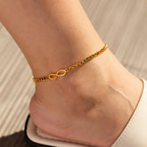 Gold titanium infinity anklet on foot