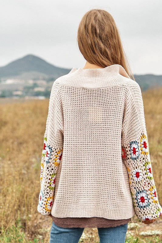 Back view of cream crochet floral knit cardigan