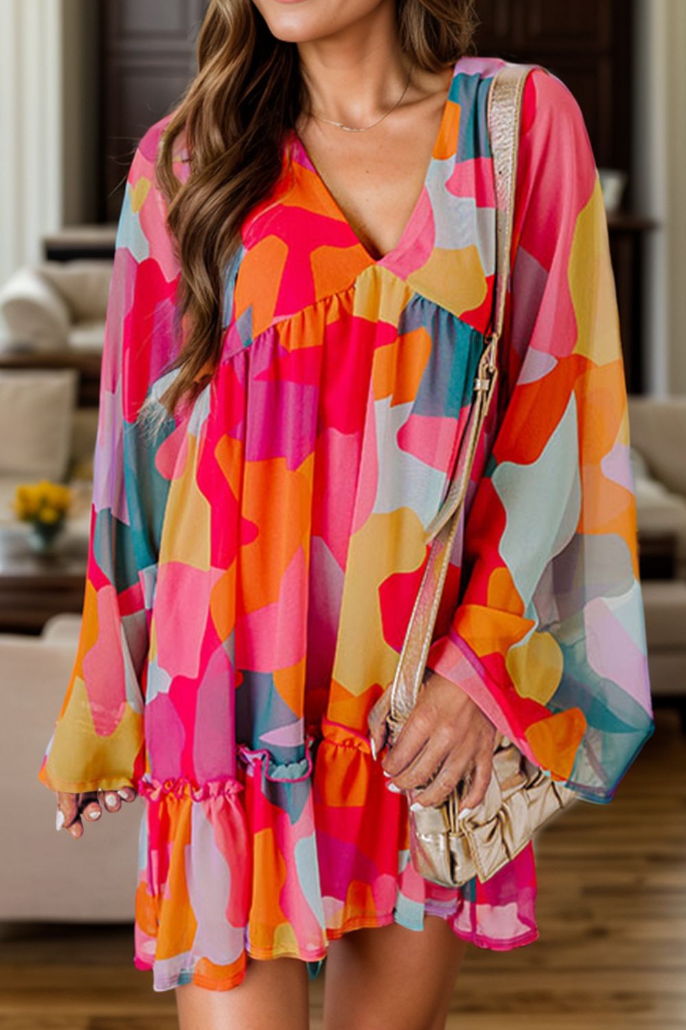 Colorful V-neck long sleeve mini dress worn by model