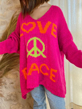 Pink V-neck sweater with peace graphic and love text