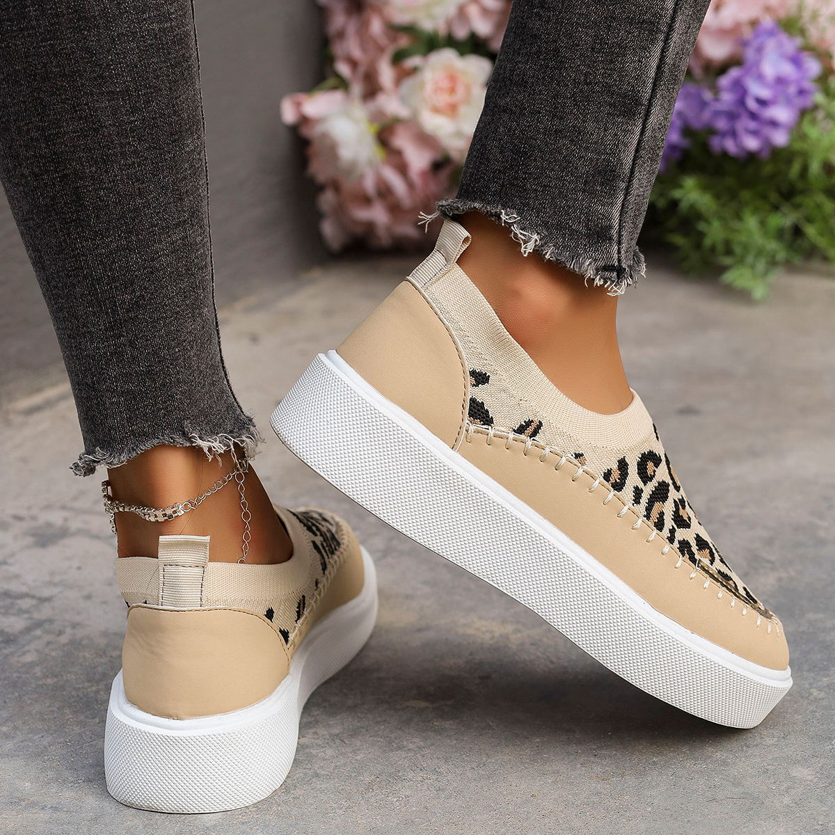 Side view of leopard platform sneakers with ankle bracelet