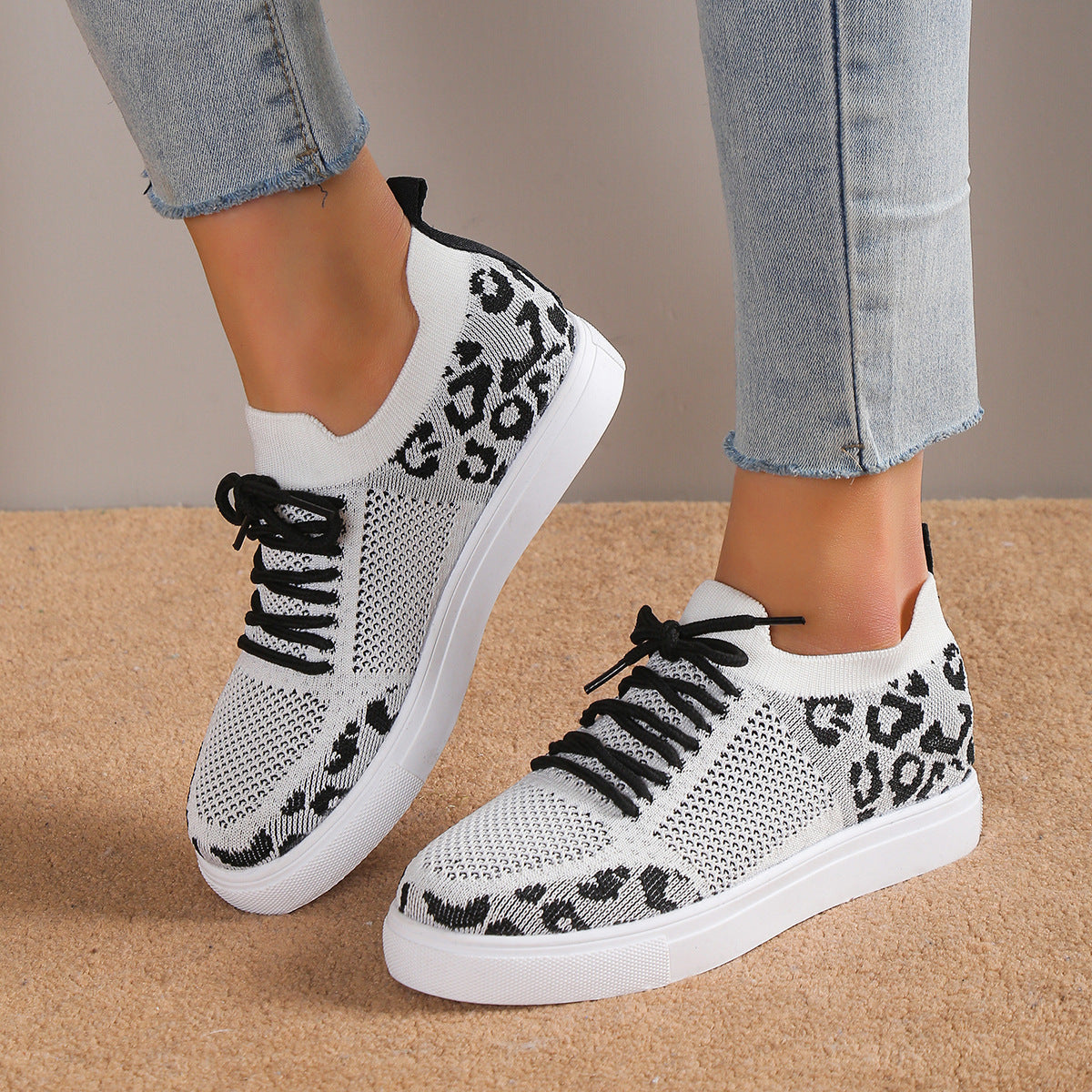 White lace-up leopard flat sneakers with black laces