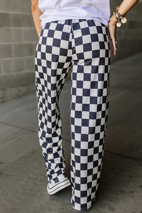 Back view of black and white checkered wide leg pants