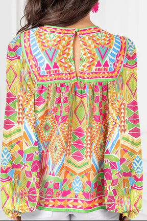 Back view of geometric printed round neck long sleeve blouse.