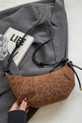 Leopard print suede shoulder bag with PU leather strap.